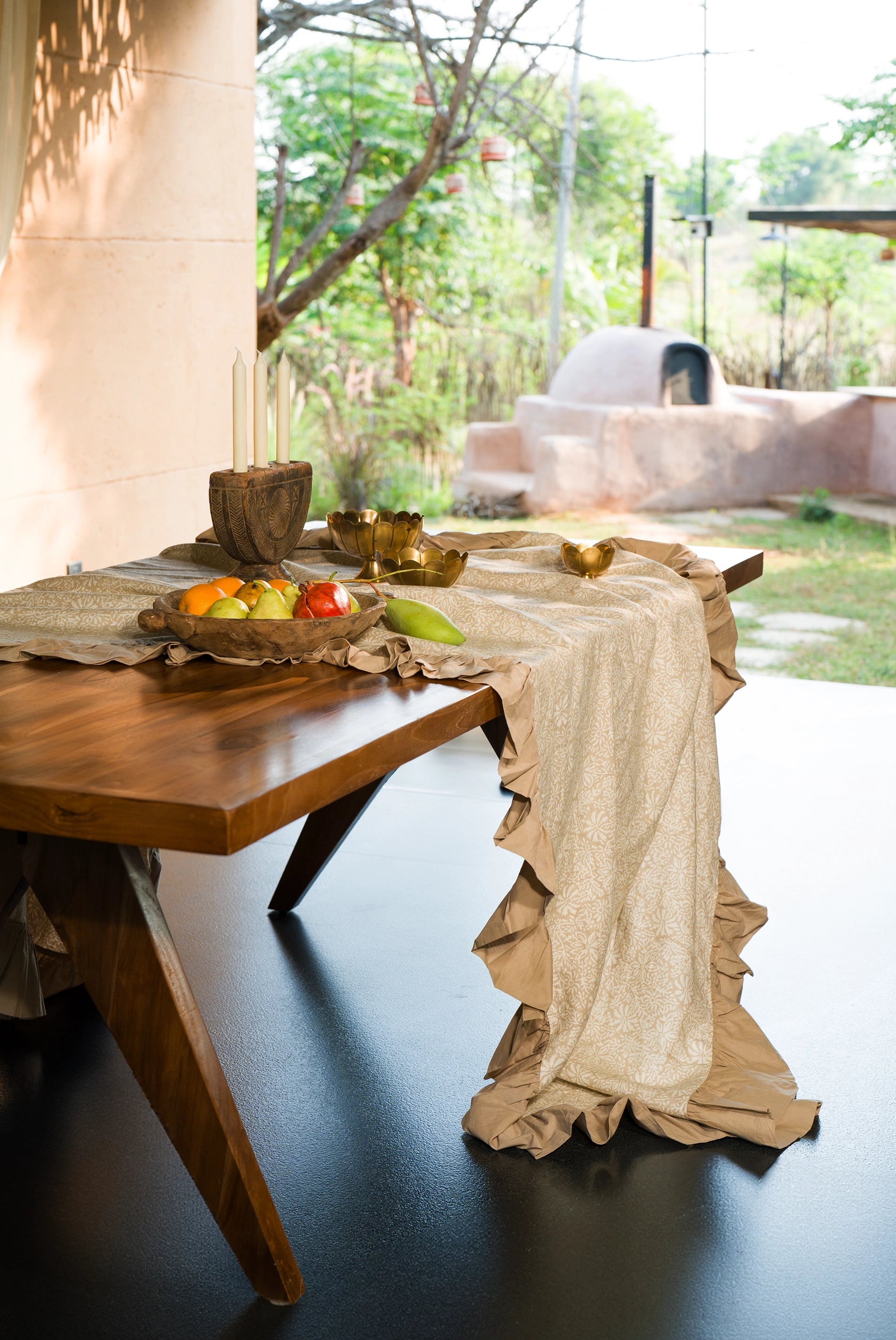 Beige hand block print European flax linen dining tablecloth styled on an elegant dining table.