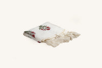 Pink floral hand block print linen throw with tasselled edge.