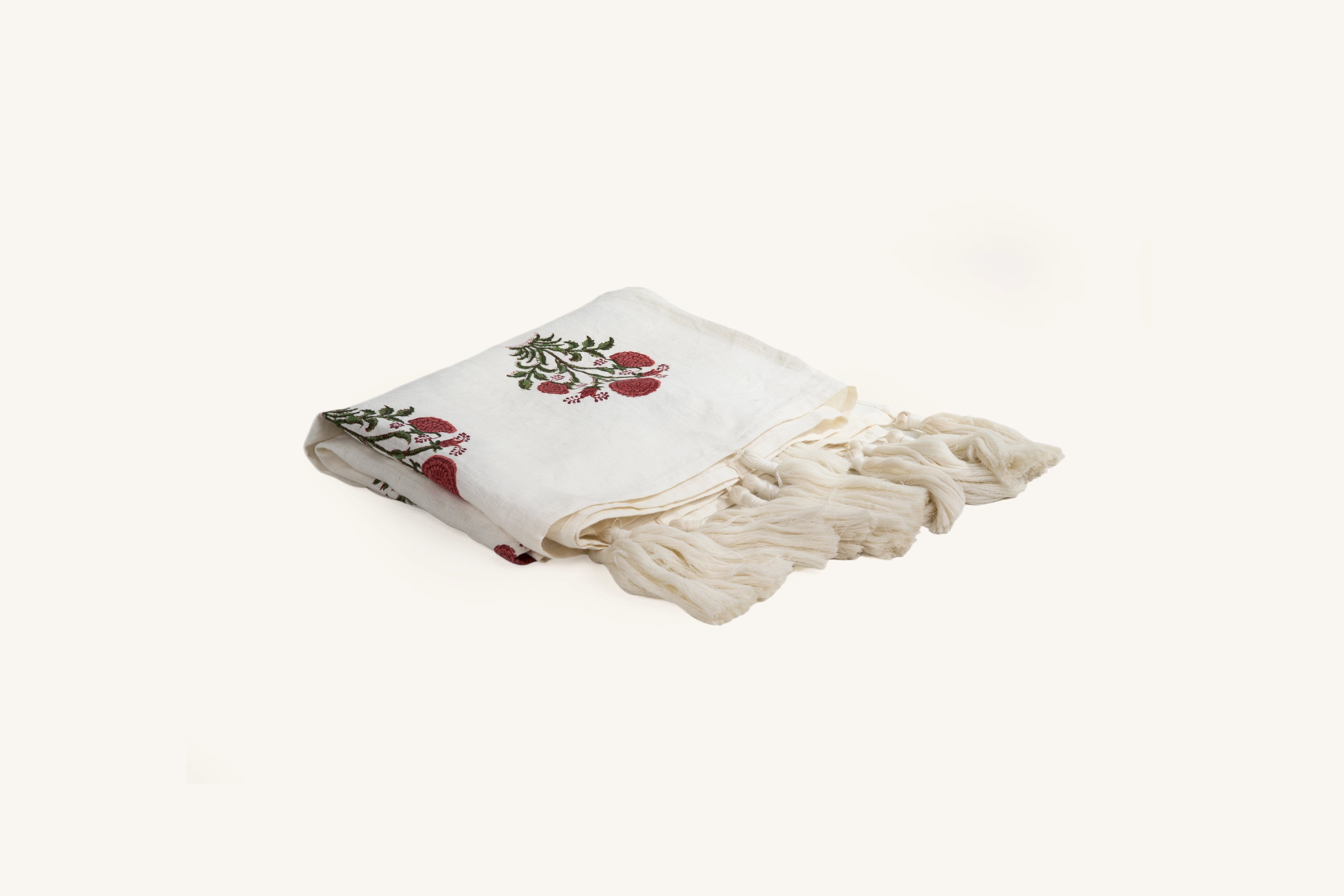 Pink floral hand block print linen throw with tasselled edge.