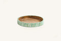 Green and white bone inlay round tray with striped design and natural wood centre.