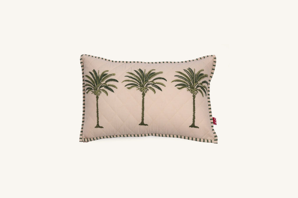 Decorative European flax linen cushion with palm tree design on a beige background