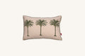 Decorative European flax linen cushion with palm tree design on a beige background