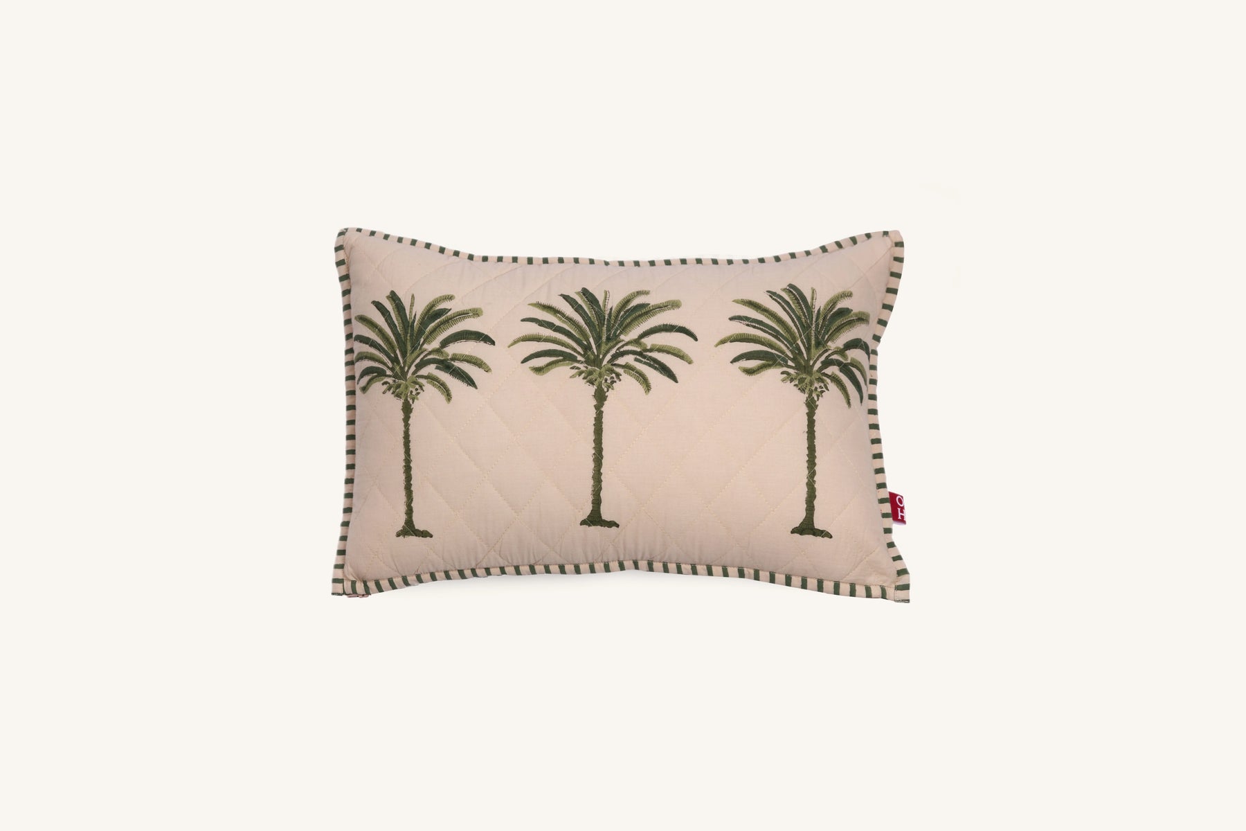 Decorative European flax linen cushion with palm tree design on a beige background