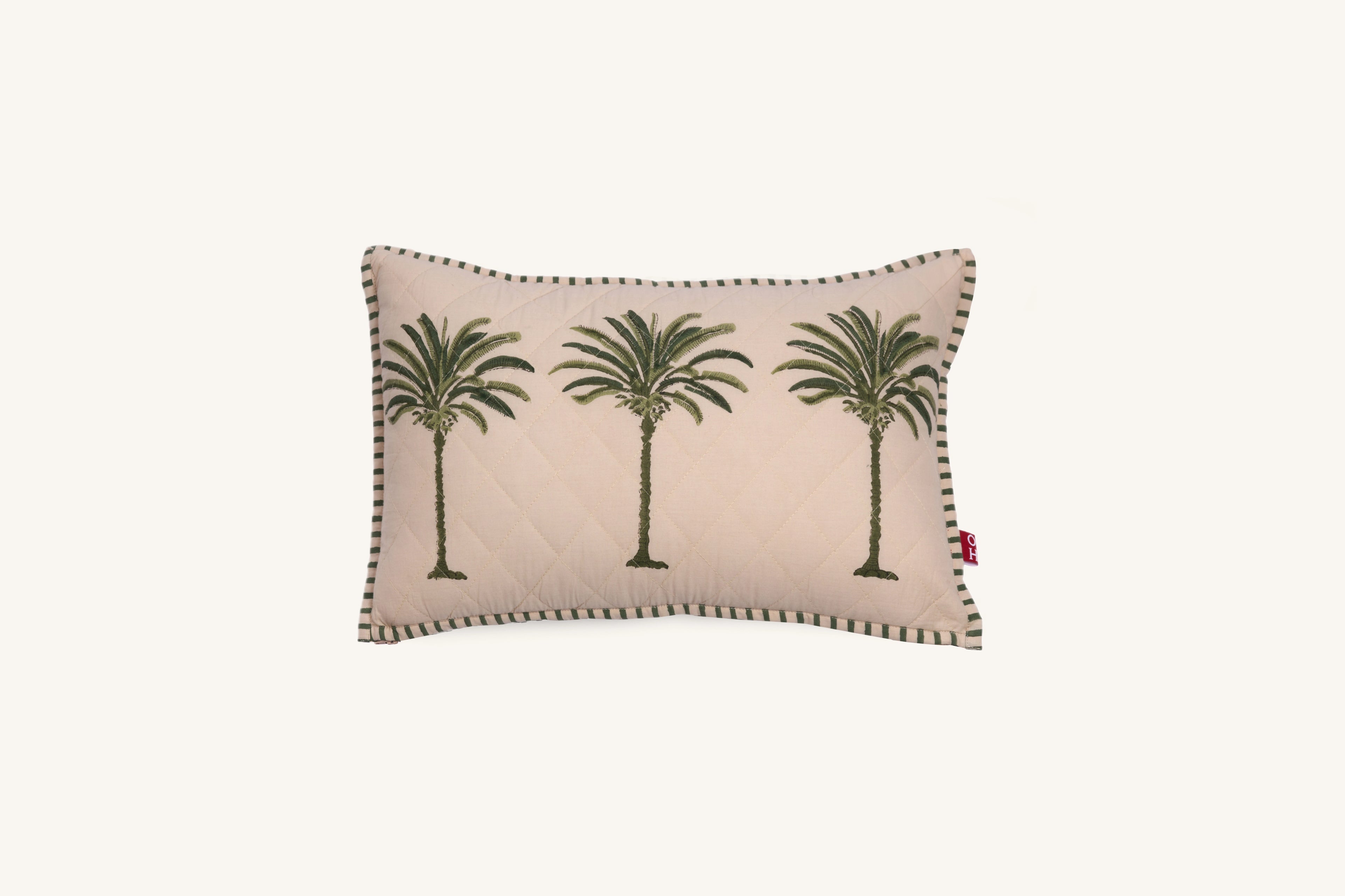 Decorative European flax linen cushion with palm tree design on a beige background
