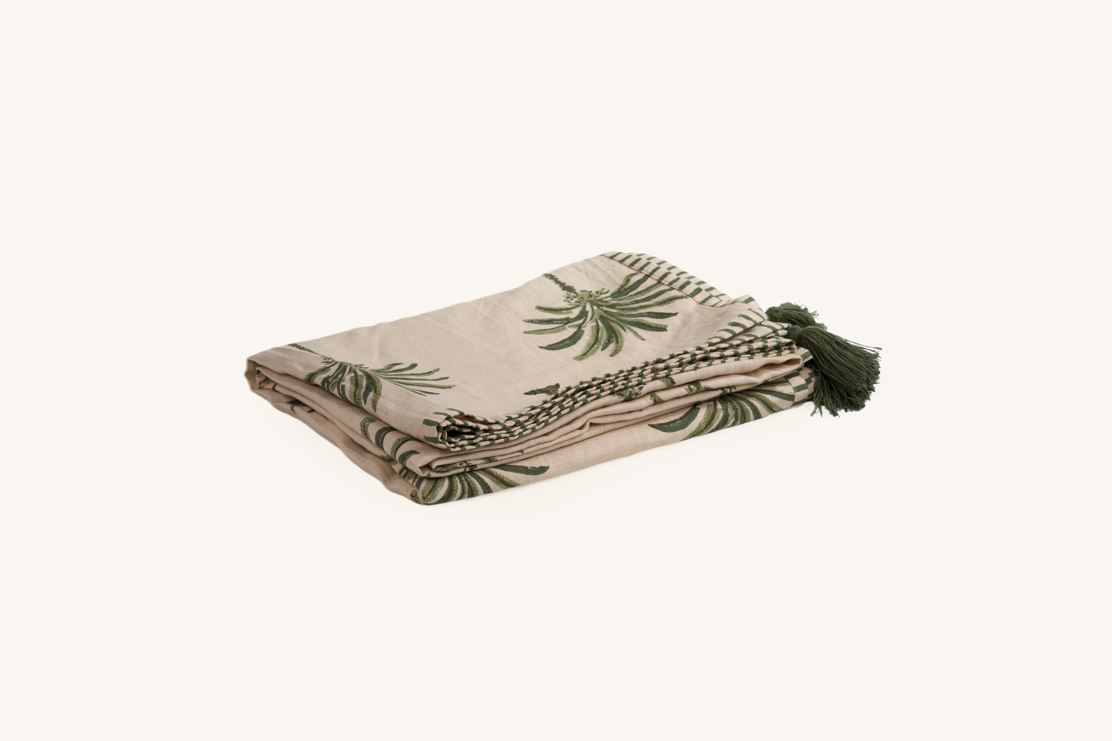 Green hand block print European flax linen throw with palm tree pattern.