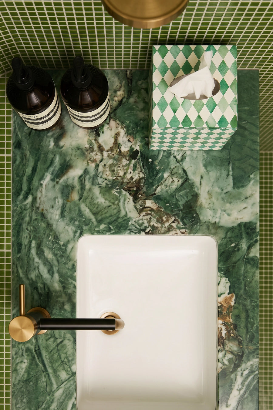 Green and white bone inlay tissue box styled in a bathroom with a hand towel.