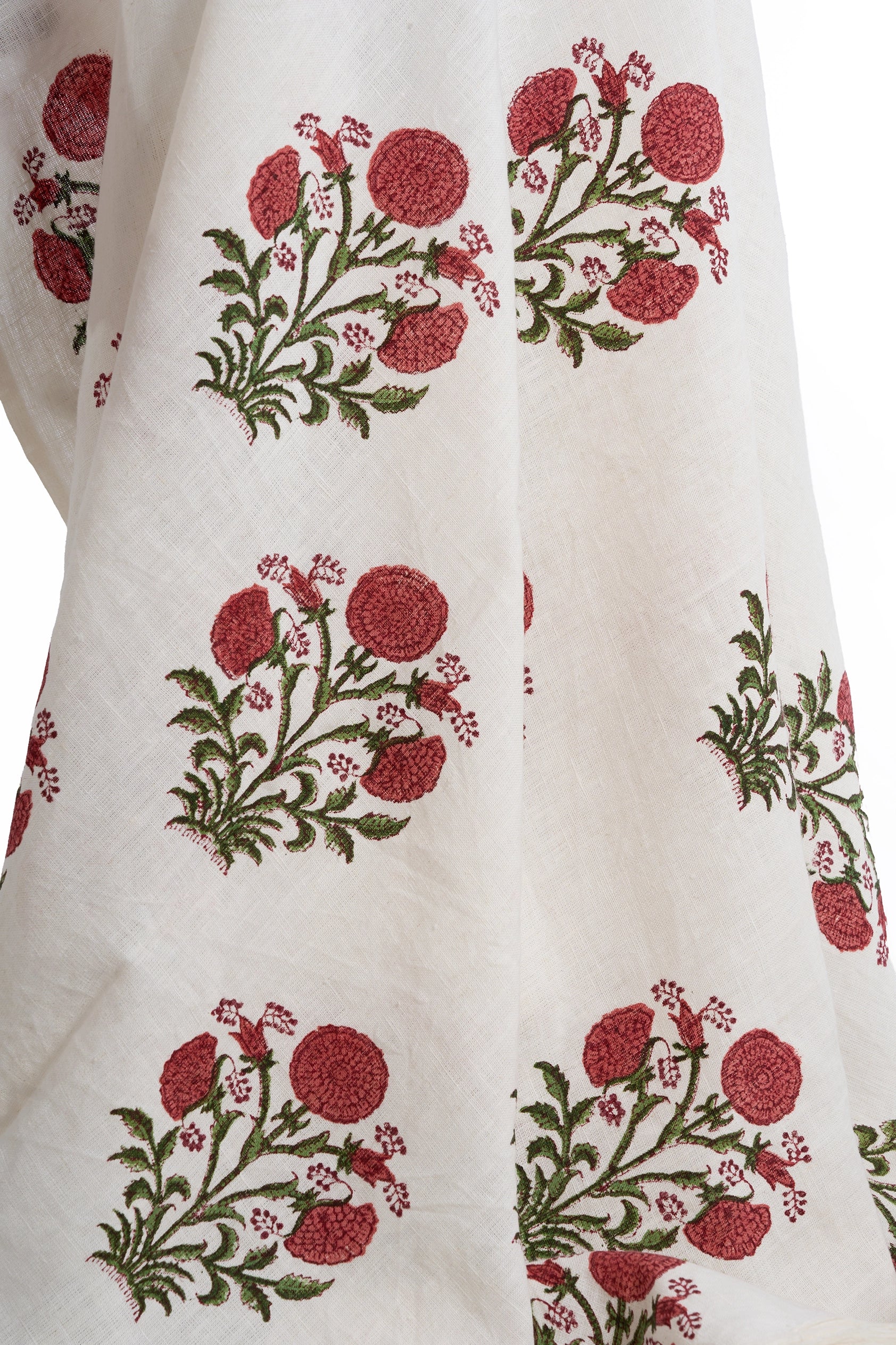 Close up of the pink floral hand block print linen throw showing the botanical pattern.