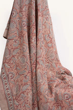 Pink floral hand block print European flax linen tablecloth draped to showcase the botanical pattern.