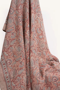 Pink floral hand block print European flax linen tablecloth draped to showcase the botanical pattern.
