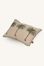 Decorative European flax linen cushion with palm tree design on a beige background