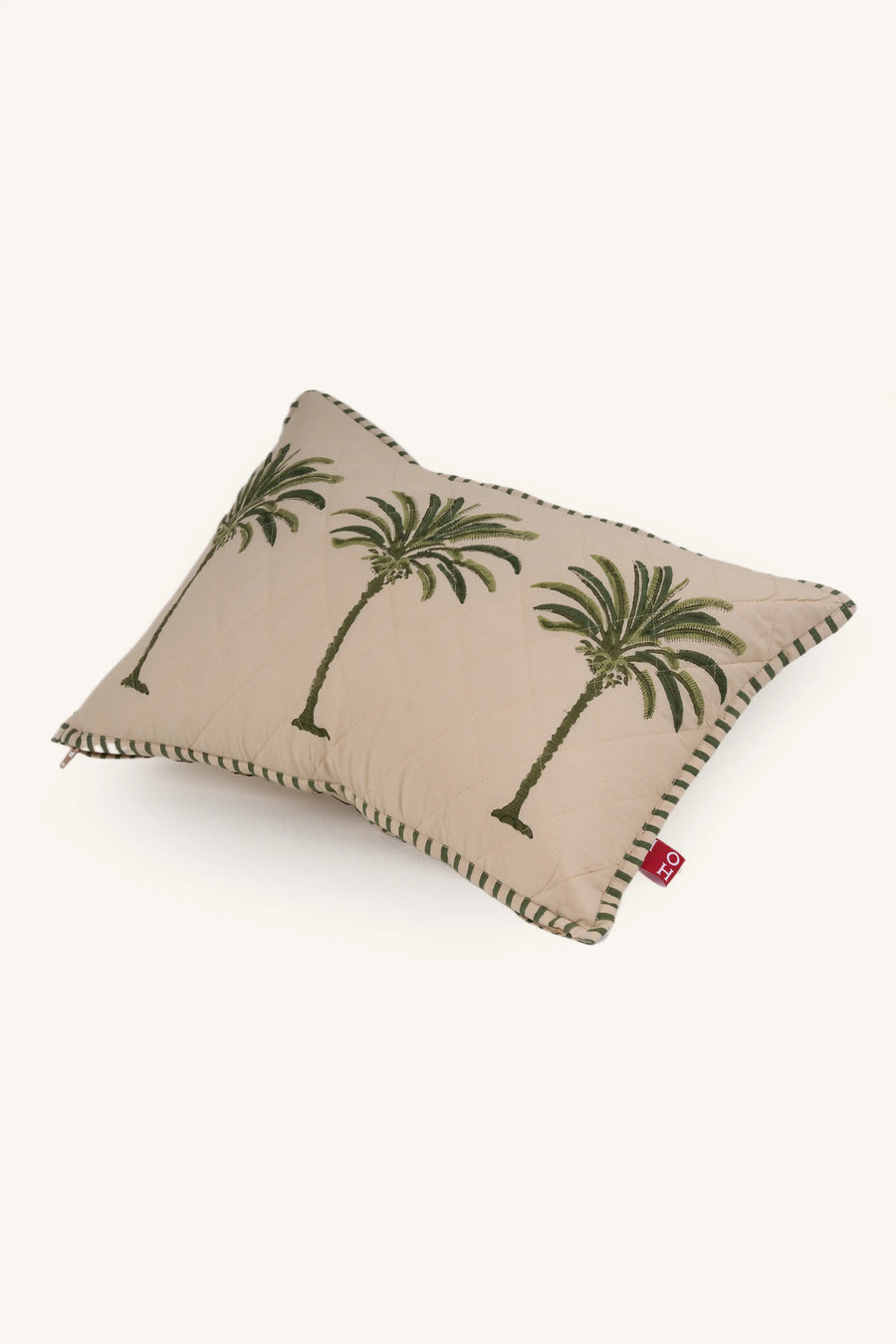 Decorative European flax linen cushion with palm tree design on a beige background