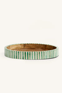 Side view of the green and white bone inlay round tray showing the striped edge.