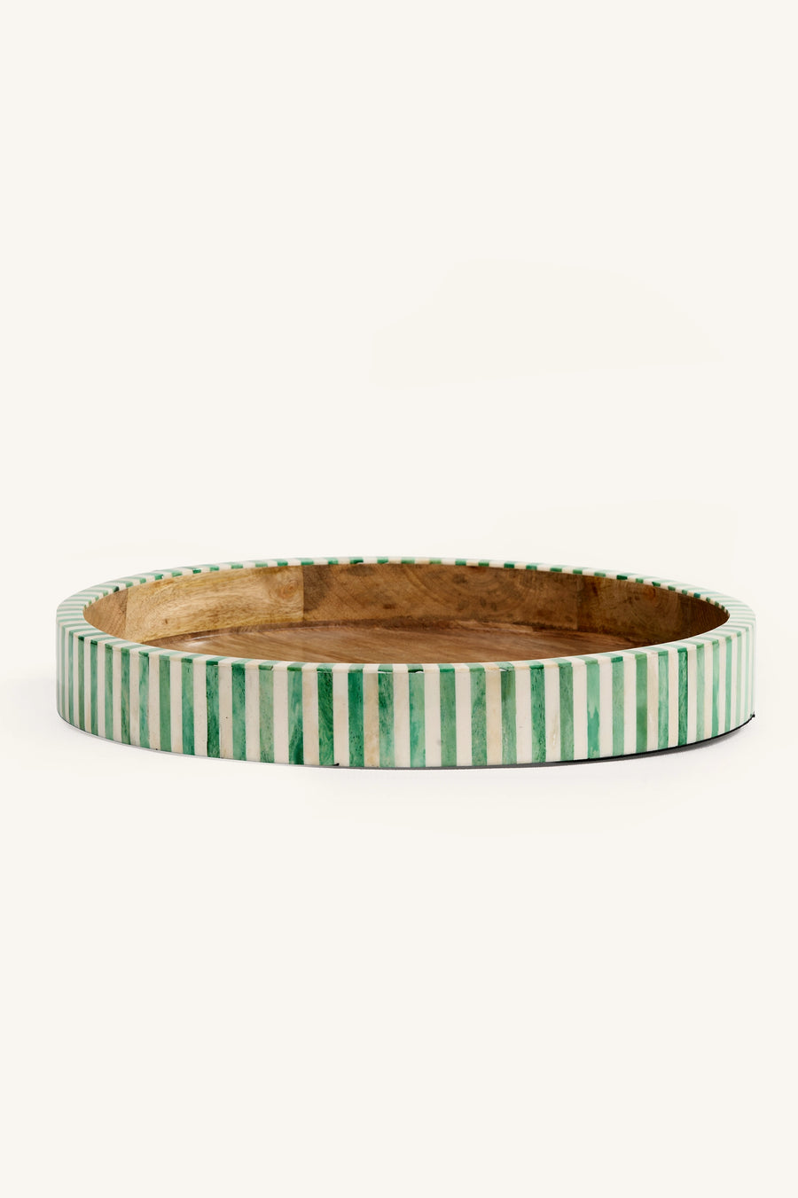 Side view of the green and white bone inlay round tray showing the striped edge.