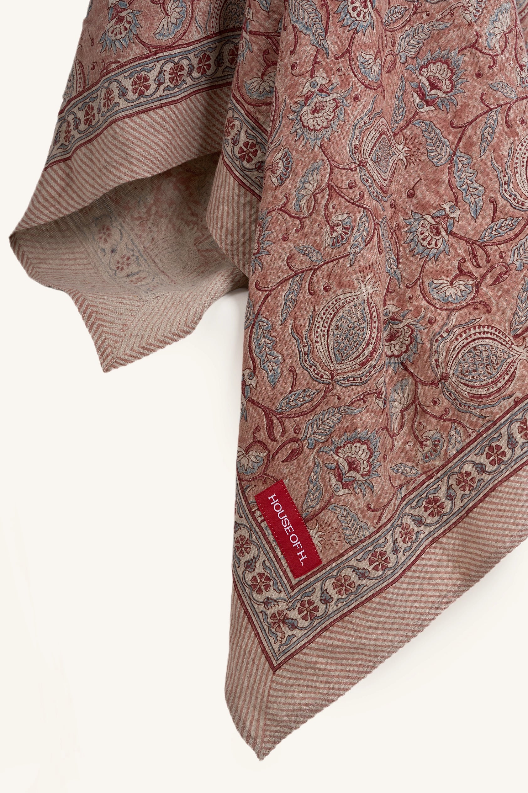 Close up of the pink floral hand block print European flax linen tablecloth.