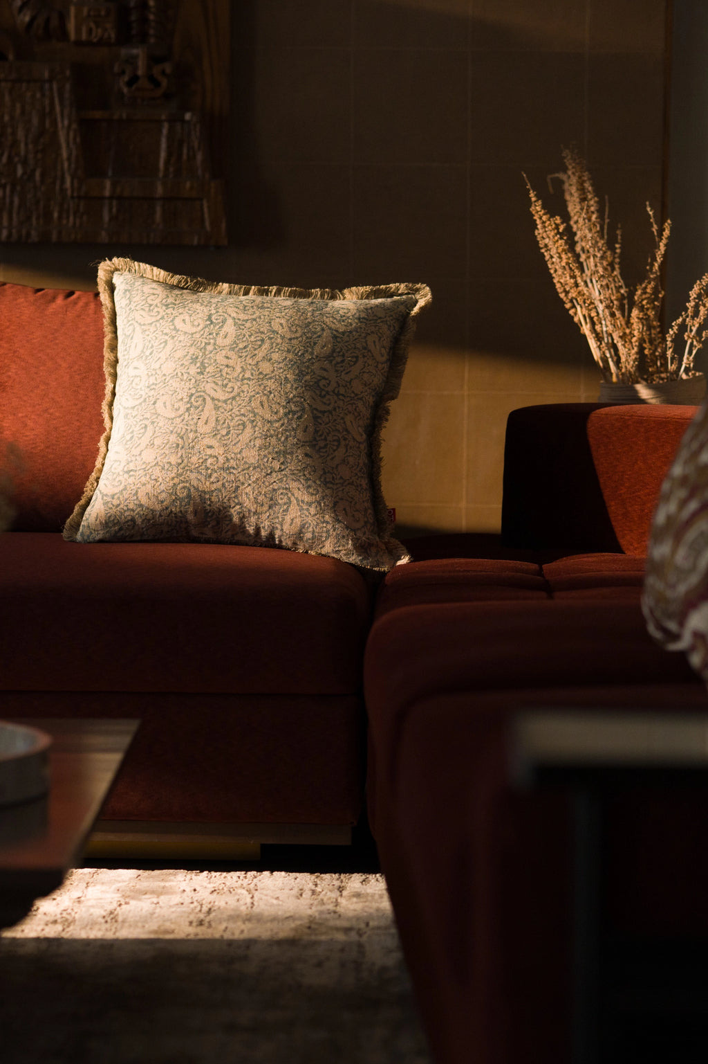 Hand block print European flax linen cushion styled in a living room.