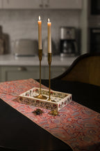 Pink hand block print cotton dining table runner styled on an elegant dining table.