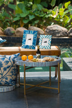 Blue and white chevron bone inlay photo frames styled outdoors on a side table.