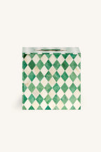 Close up of the green and white bone inlay harlequin diamond pattern.