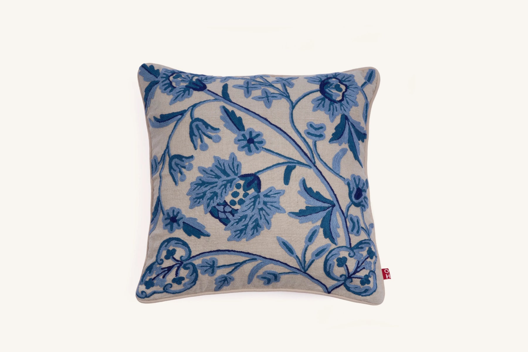 Blue crewel embroidered linen cushion with botanical design.