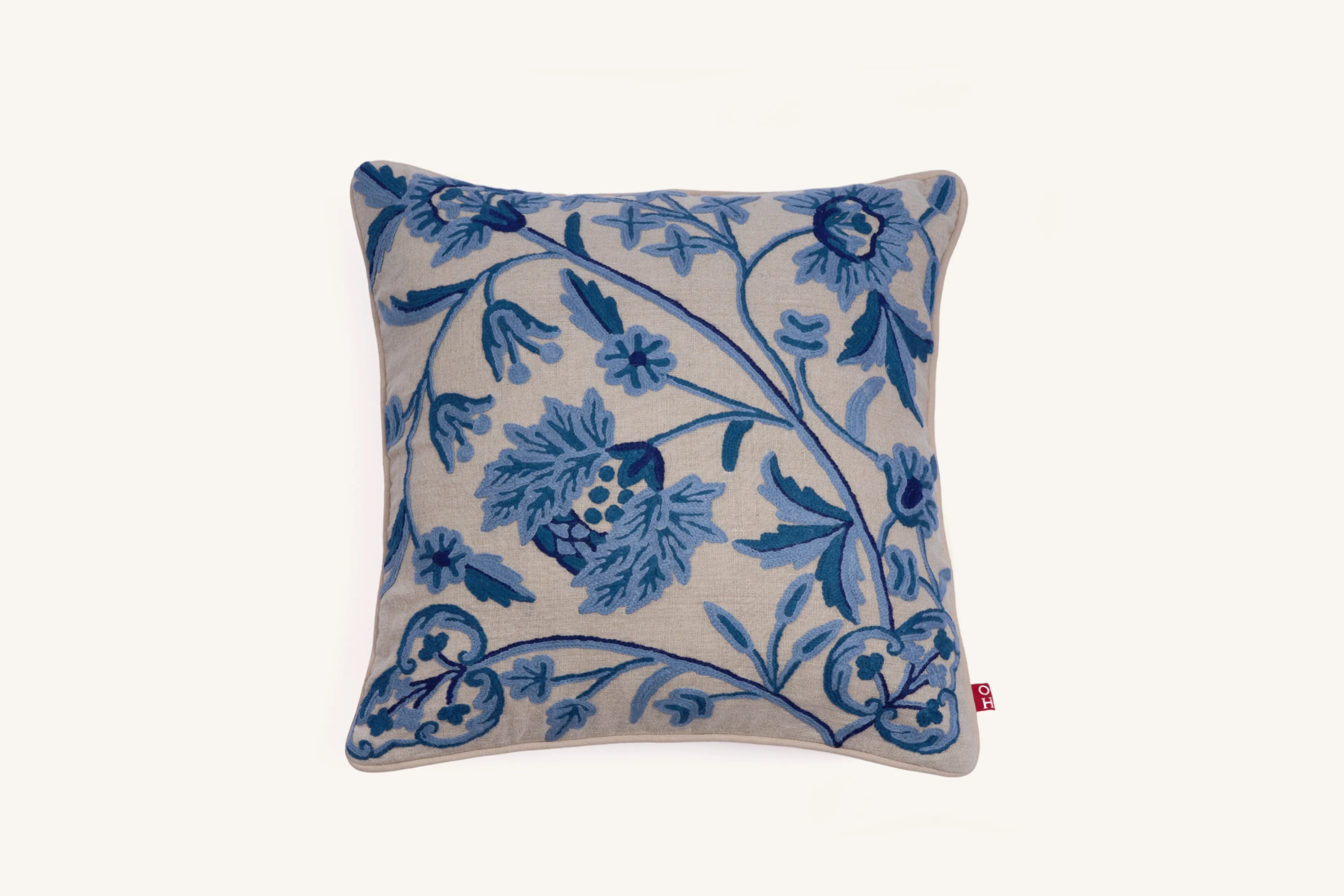 Blue crewel embroidered linen cushion with botanical design.