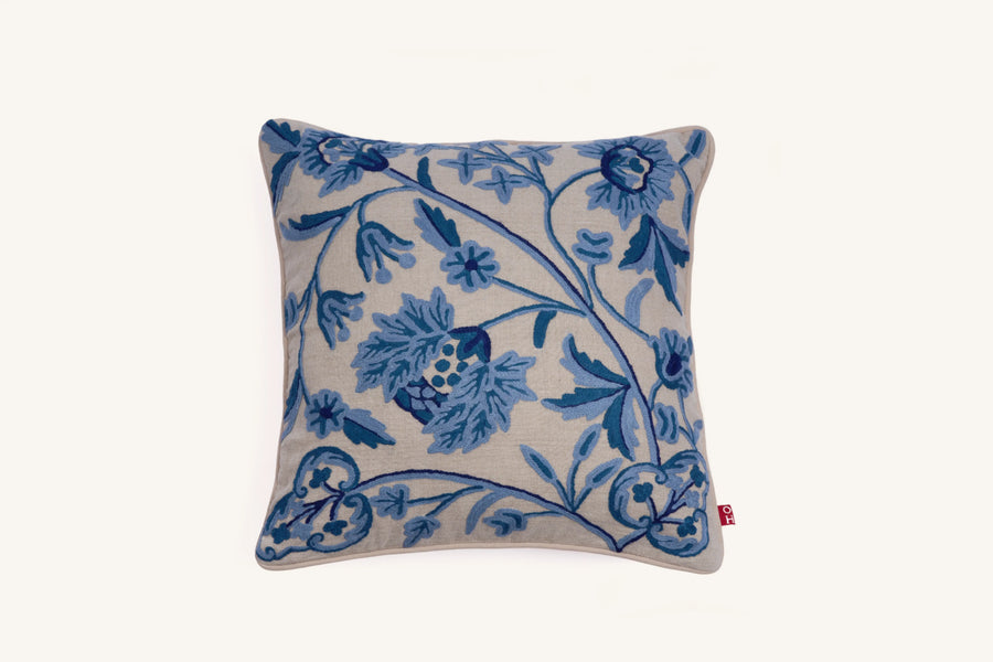 Blue crewel embroidered linen cushion with botanical design.