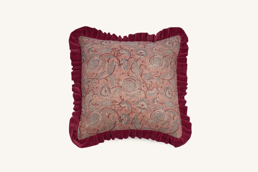 Square pink floral hand block print linen cushion with ruffled edge.