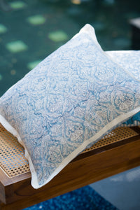 Blue hand block print European flax linen cushion styled on a timber bench.