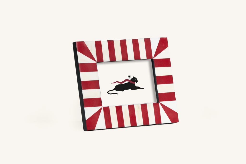 Square red and ivory starburst bone inlay photo frame.