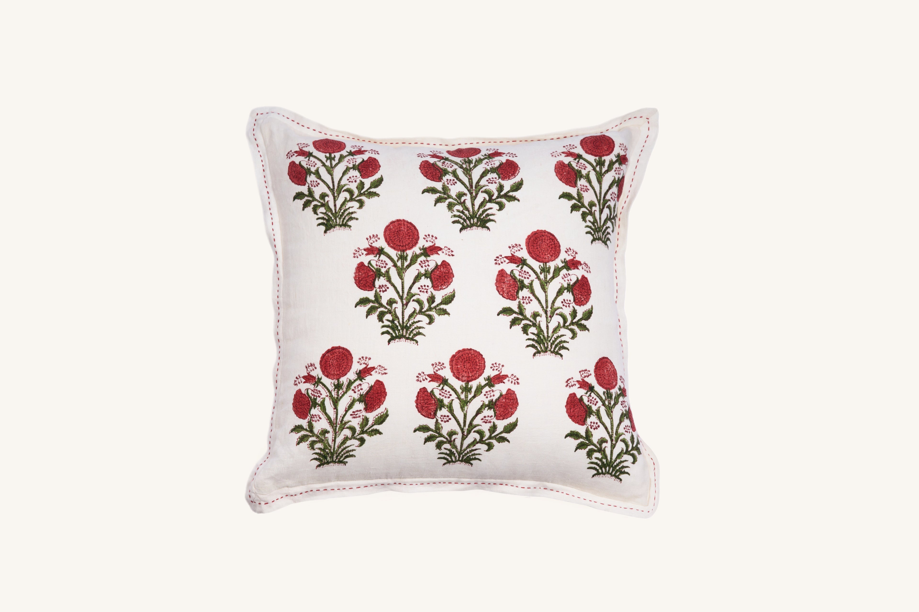 Square pink floral hand block print linen cushion with botanical design.