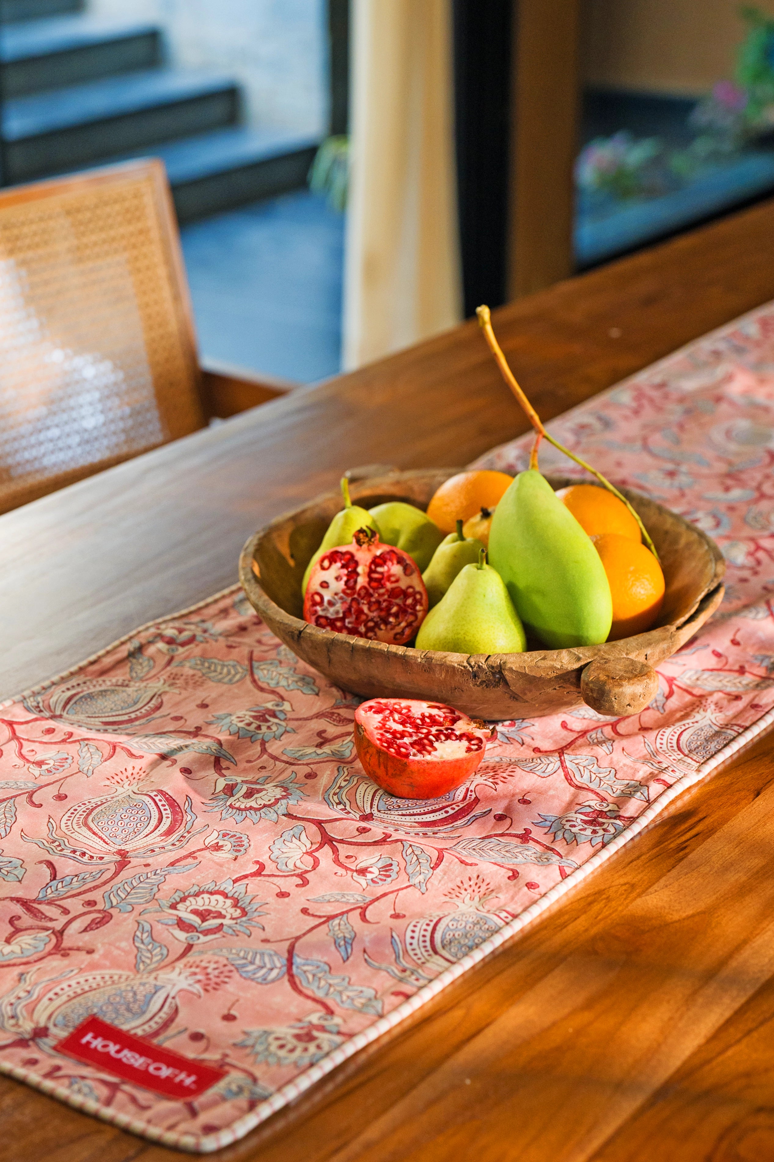 Close up of the hand block print floral pattern on the pink cotton dining table runner.
